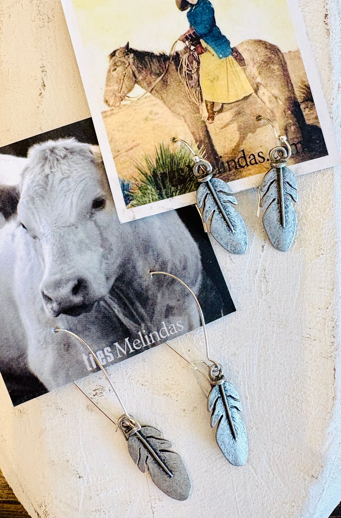Tres Melindas: Feather Earrings